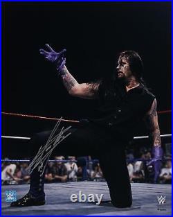 The Undertaker WWE Autographed 16 x 20 In Ring Kneeling Photograph